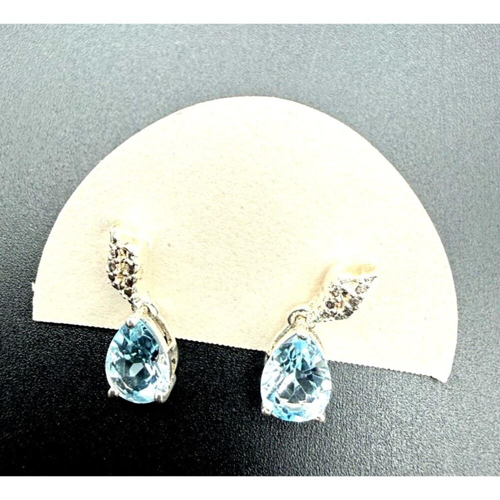 18 Kt White Gold stud earrings,  Blue topaz with Diamond Accent